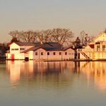 Sunlit boat sheds by Christine Thompson